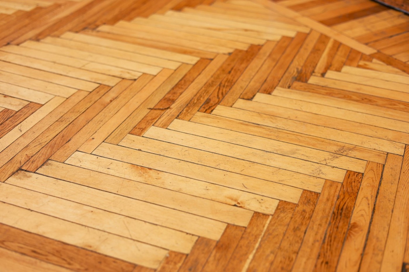 Close view of a herringbone wood floor